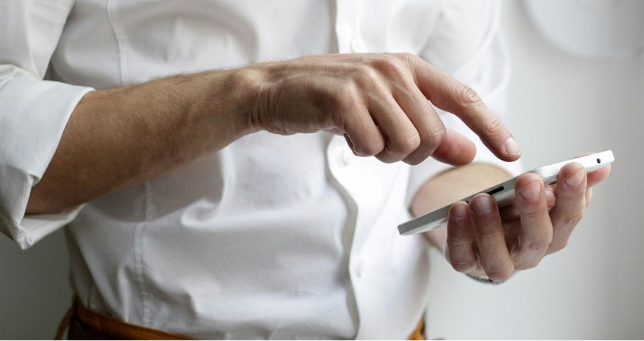 man holding white phone