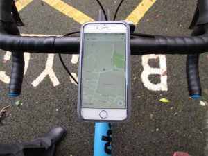 mobile phone in Quadlock waterproof case on handlebars