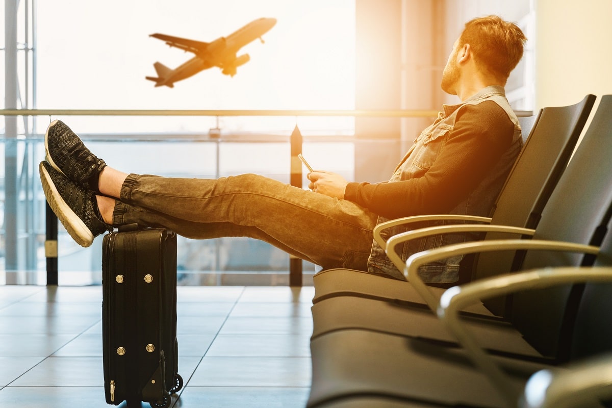 man in airport on phone